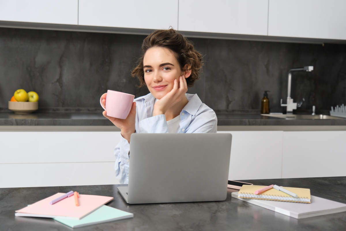 Small business owner at laptop enjoying best passive income for small business 2025.