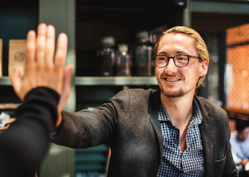 5 Passive Income Ideas for Small Business Owners in 2025: Boost Your Revenue with Ease 11 Owner celebrating next steps for best passive income for small business 2025.