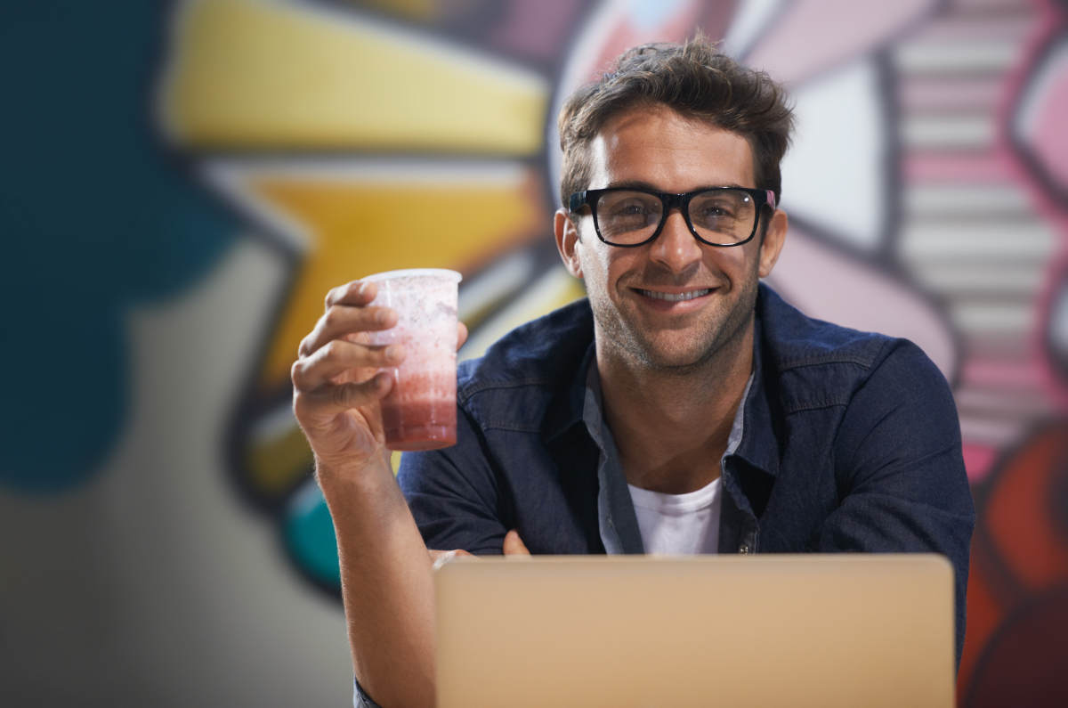 Smiling entrepreneur packaging Etsy orders, showing what side hustle is best for you in 2025.